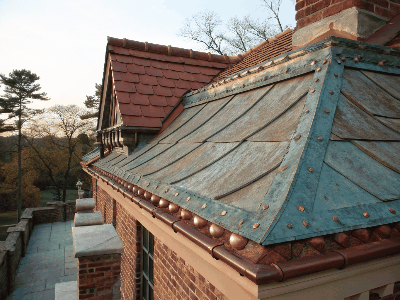Artisan copper valley flashing and synthetic slate roof installation