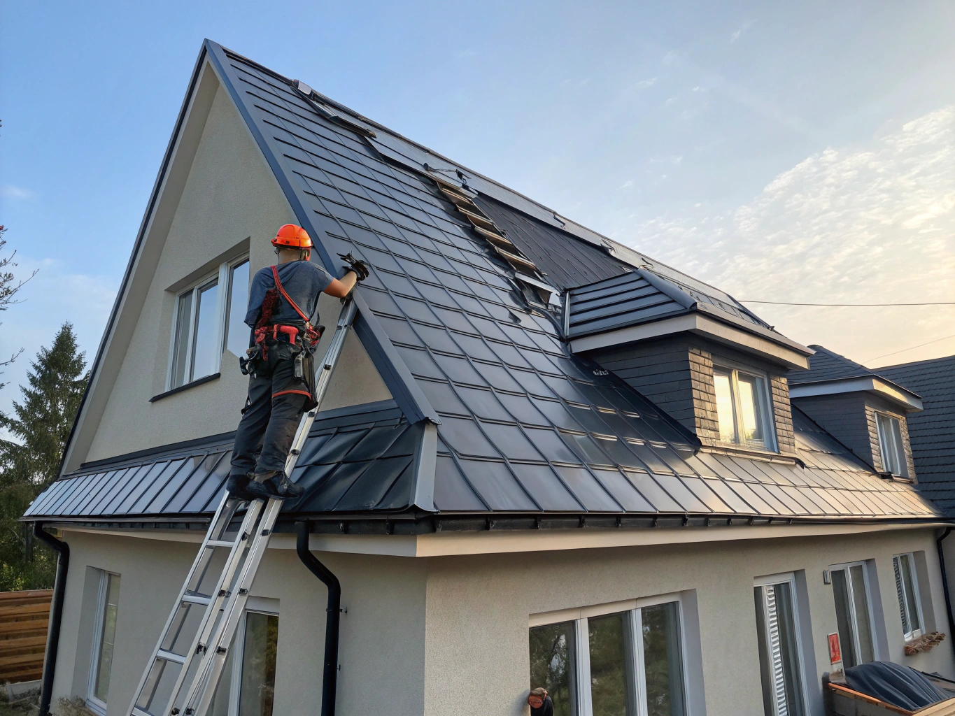 Modern residential home with charcoal gray standing seam metal roofing