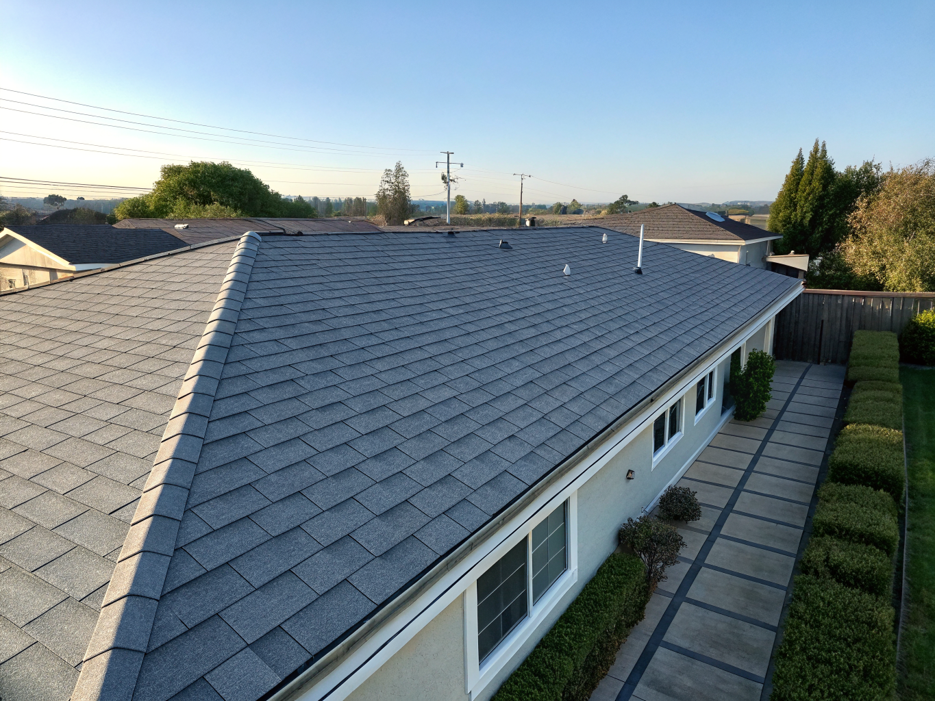 Modern dimensional charcoal architectural shingle roof installation